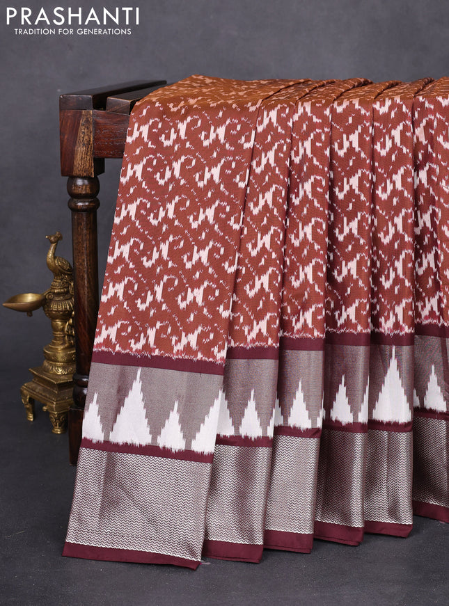 Pochampally silk saree brown and wine shade with allover ikat weaves and long ikat woven silver zari border