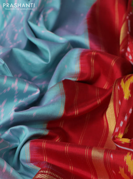Pochampally silk saree dual shade of teal blue and red with allover ikat weaves and long ikat woven zari border