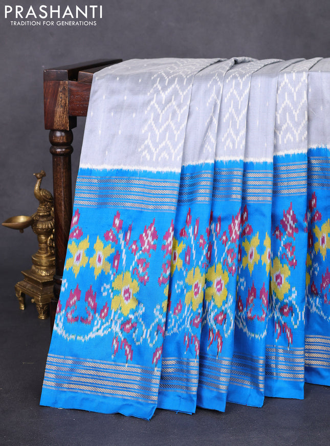 Pochampally silk saree grey and cs blue with allover ikat weaves and long ikat woven zari border