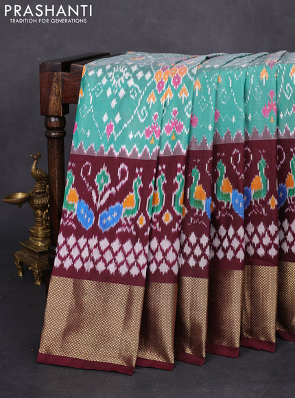 Pochampally silk saree teal green and deep maroon with allover ikat weaves and long ikat woven zari woven border