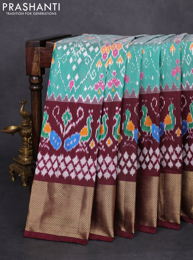 Pochampally silk saree teal green and deep maroon with allover ikat weaves and long ikat woven zari woven border