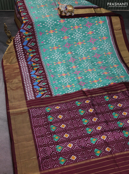 Pochampally silk saree teal green and deep maroon with allover ikat weaves and long ikat woven zari woven border