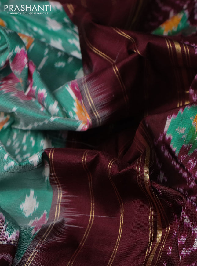 Pochampally silk saree teal green and deep maroon with allover ikat weaves and long ikat woven zari woven border