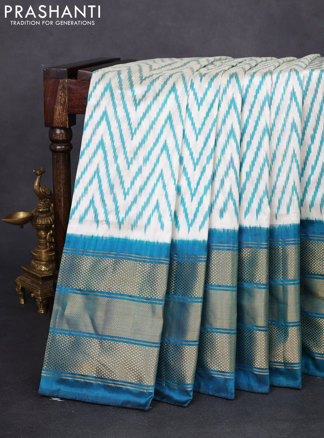 Pochampally silk saree cream and peacock green with allover zig zag ikat weaves and long zari woven border