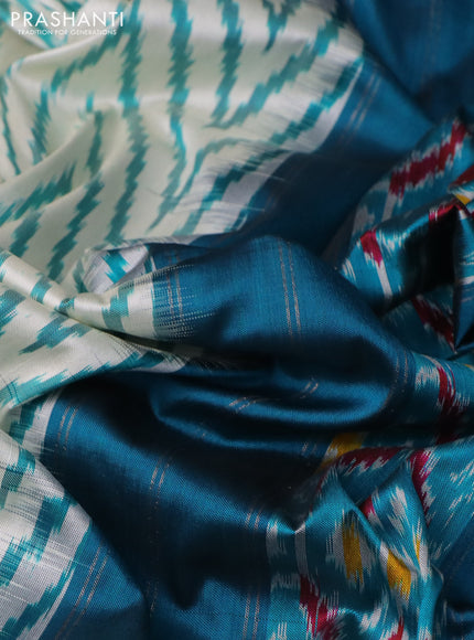 Pochampally silk saree cream and peacock green with allover zig zag ikat weaves and long zari woven border