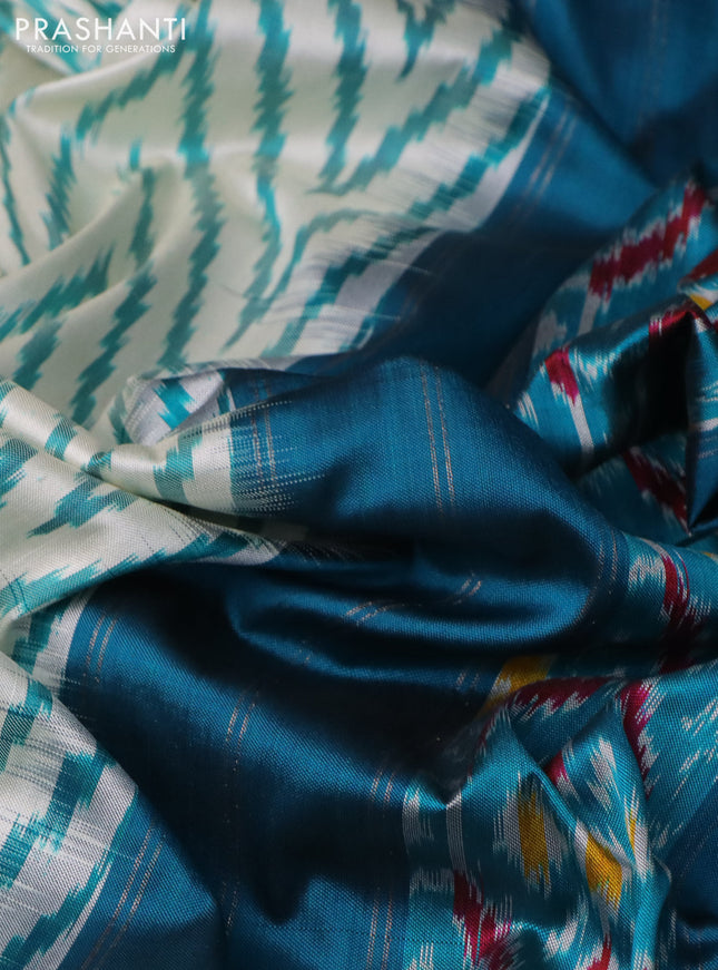 Pochampally silk saree cream and peacock green with allover zig zag ikat weaves and long zari woven border