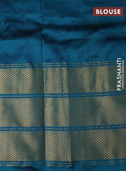 Pochampally silk saree cream and peacock green with allover zig zag ikat weaves and long zari woven border