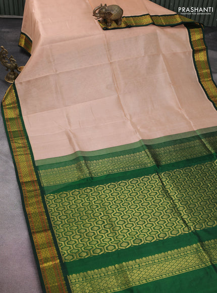 Silk cotton saree sandal and green with plain body and zari woven korvai border