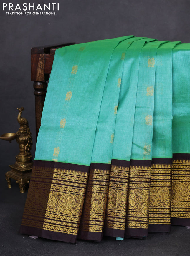 Silk cotton saree teal green and black with annam zari woven buttas and zari woven korvai border