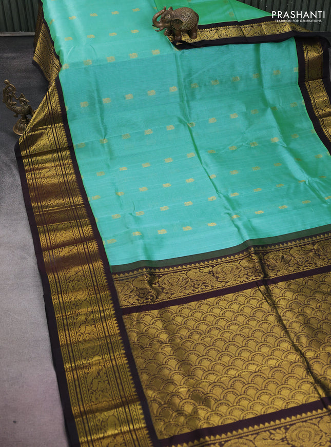 Silk cotton saree teal green and black with annam zari woven buttas and zari woven korvai border