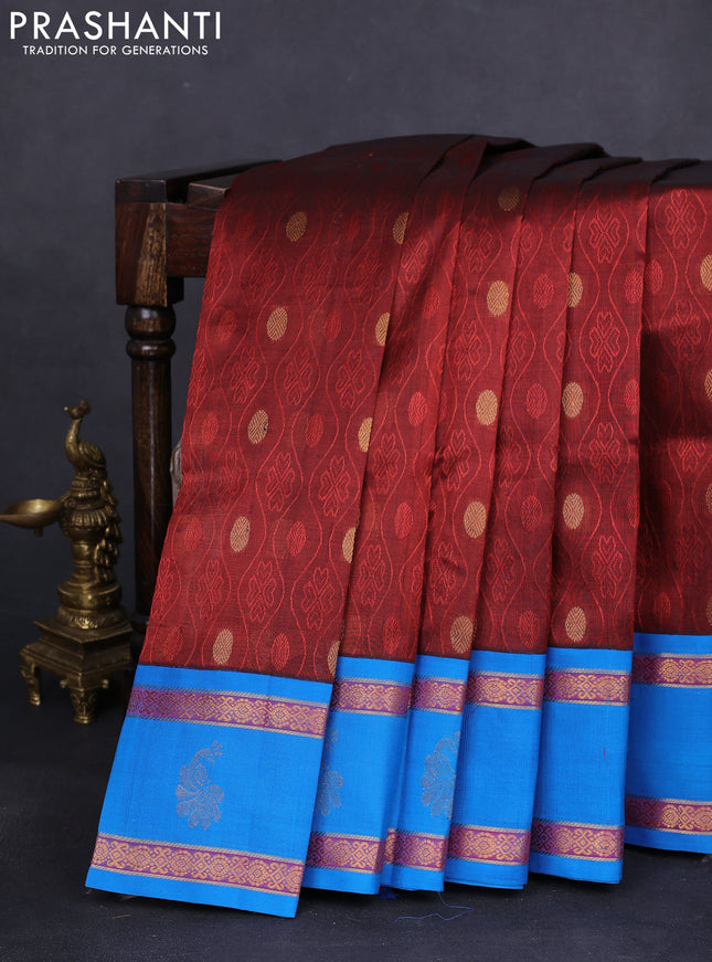 Silk cotton saree maroon and cs blue with self emboss & zari buttas and zari woven korvai border
