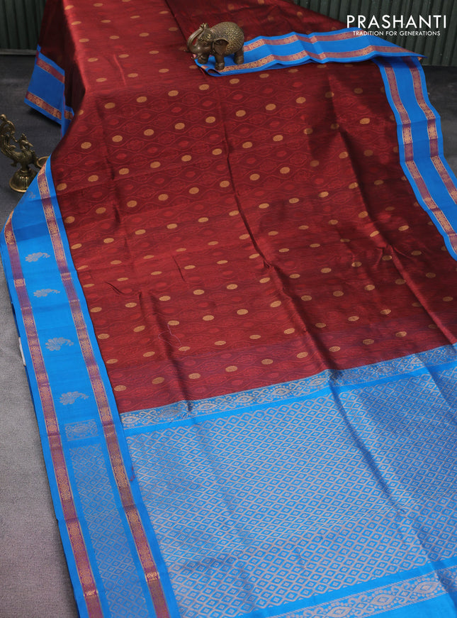 Silk cotton saree maroon and cs blue with self emboss & zari buttas and zari woven korvai border