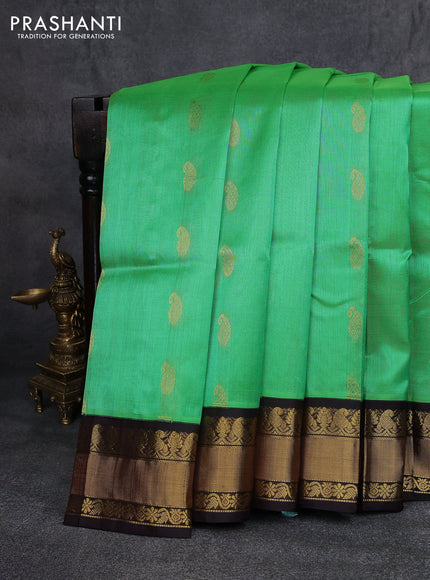 Kuppadam silk cotton saree light green and coffee brown with paisley zari woven buttas and zari woven border