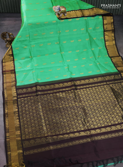 Kuppadam silk cotton saree light green and coffee brown with paisley zari woven buttas and zari woven border