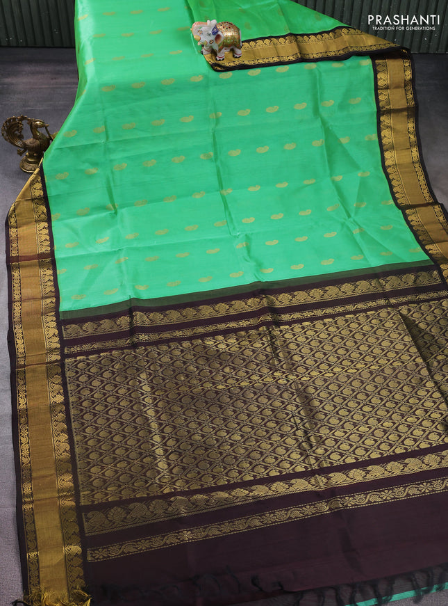 Kuppadam silk cotton saree light green and coffee brown with paisley zari woven buttas and zari woven border