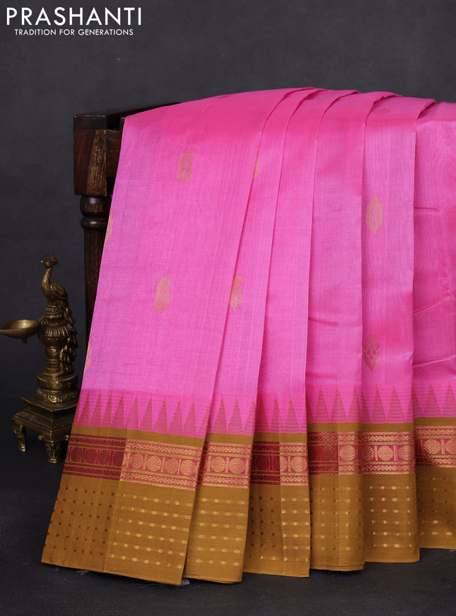 Kuppadam silk cotton saree light pink and dark mustard with zari woven buttas and temple design zari woven border