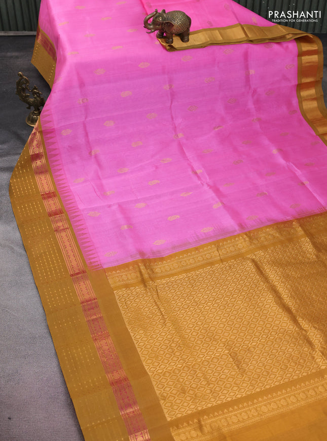 Kuppadam silk cotton saree light pink and dark mustard with zari woven buttas and temple design zari woven border