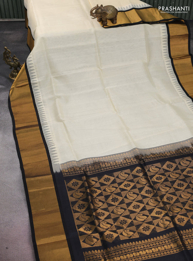 Kuppadam silk cotton saree cream and black with plain body and temple design zari woven border