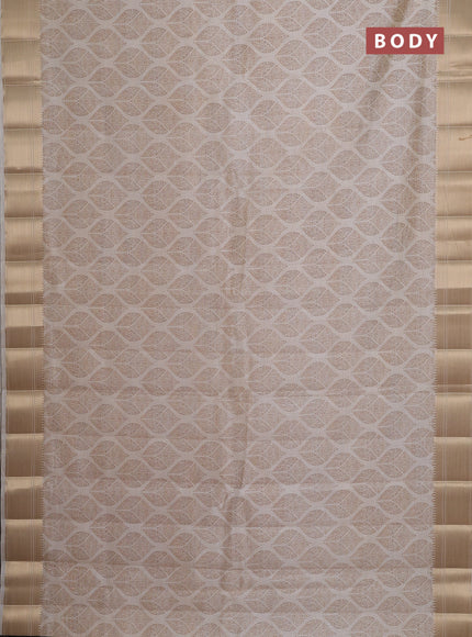 Semi raw silk saree cream with allover butta prints and zari woven border