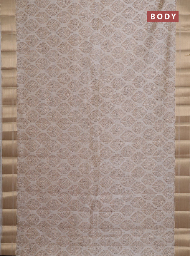 Semi raw silk saree cream with allover butta prints and zari woven border