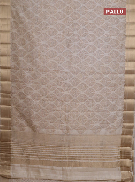 Semi raw silk saree cream with allover butta prints and zari woven border