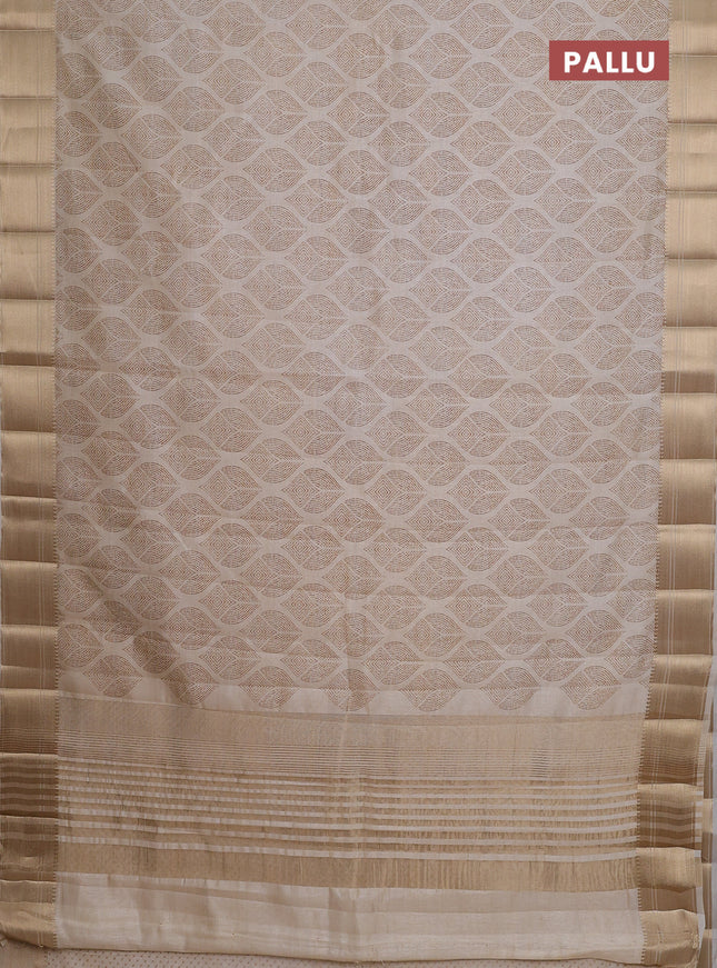 Semi raw silk saree cream with allover butta prints and zari woven border