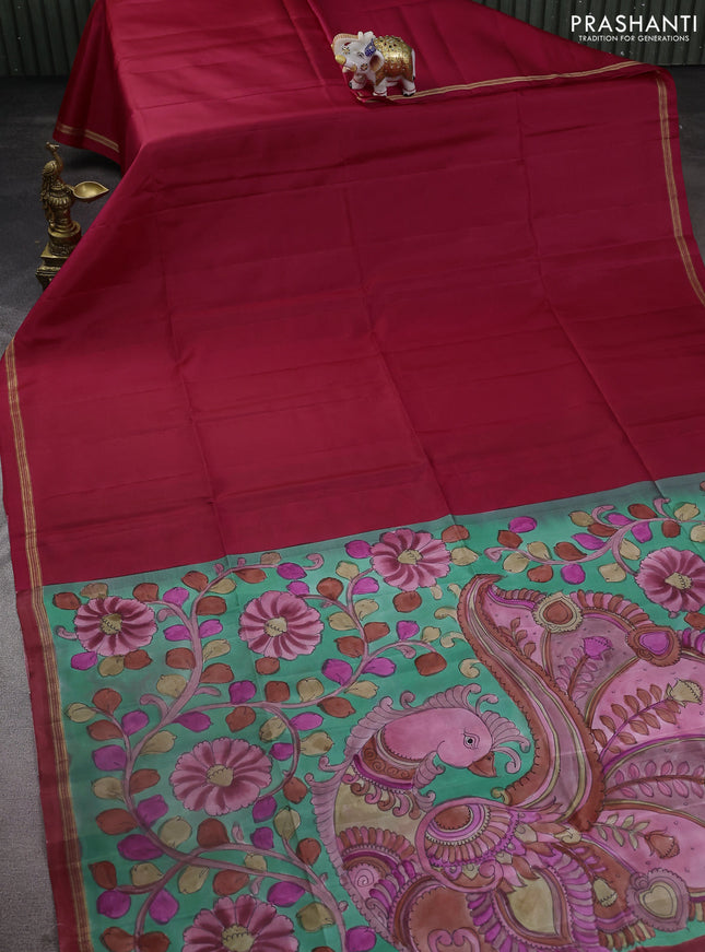 Pure soft silk saree tomato red and pastel green with plain body and kalamkari hand painted pallu