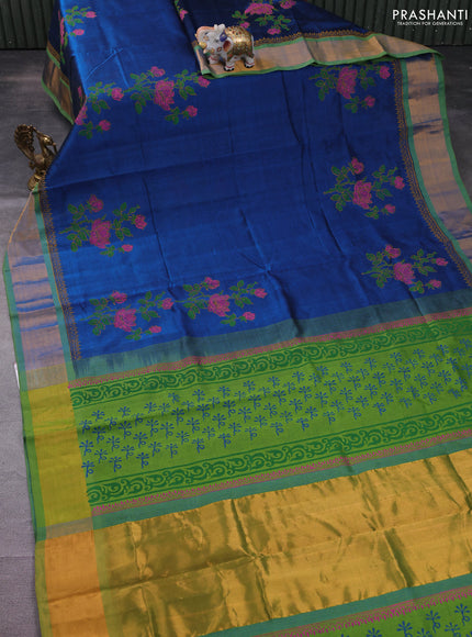 Silk cotton block printed saree peacock blue and light green with floral prints and zari woven border