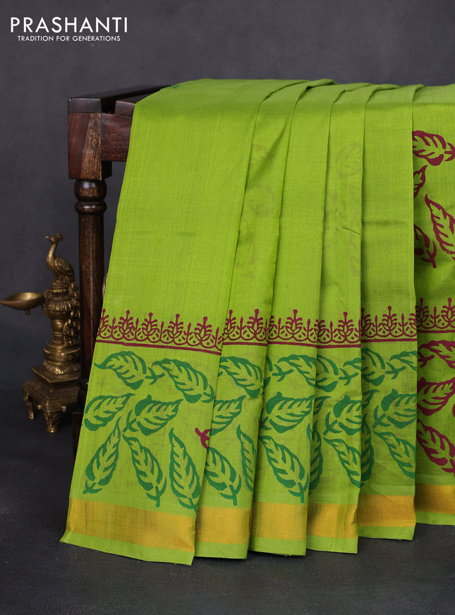 Silk cotton block printed saree light green with leaf prints and zari woven border