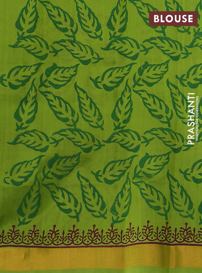 Silk cotton block printed saree light green with leaf prints and zari woven border