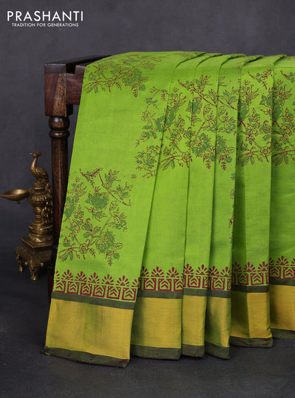 Silk cotton block printed saree light green and wine shade with allover floral prints and zari woven border