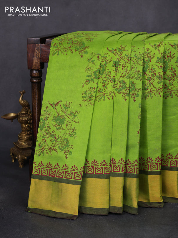 Silk cotton block printed saree light green and wine shade with allover floral prints and zari woven border