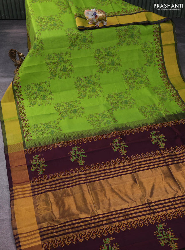 Silk cotton block printed saree light green and wine shade with allover floral prints and zari woven border