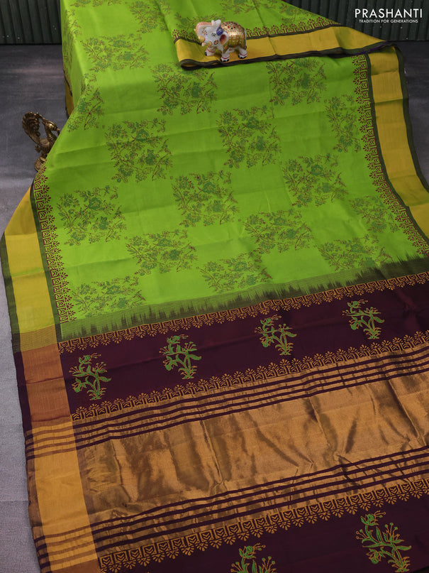 Silk cotton block printed saree light green and wine shade with allover floral prints and zari woven border