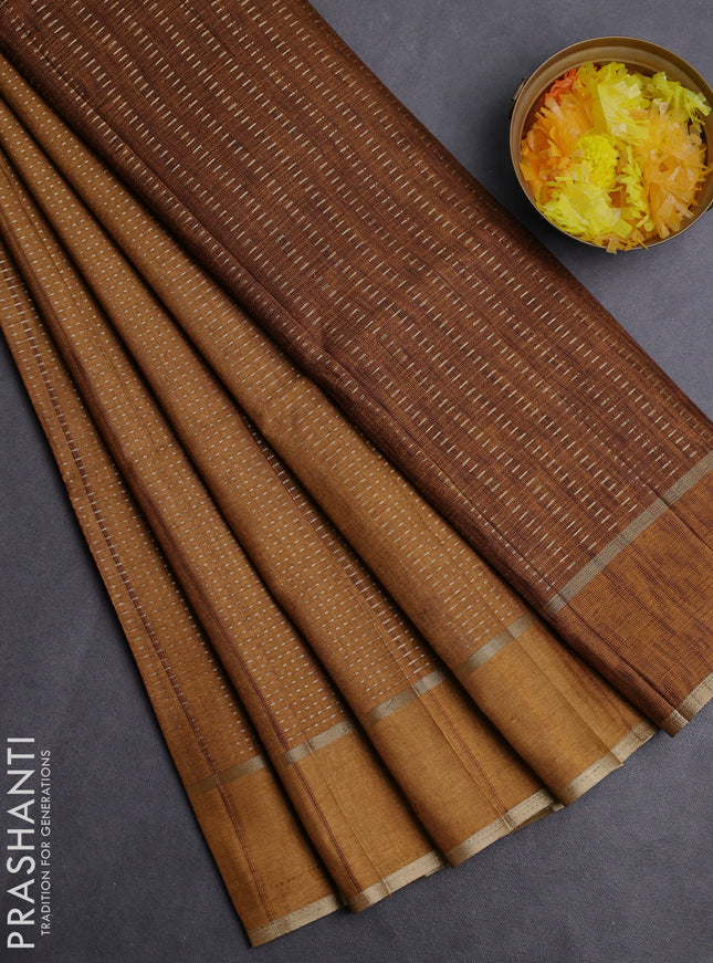 Semi matka saree dark mustard with allover zari weaves and rettapet zari woven border