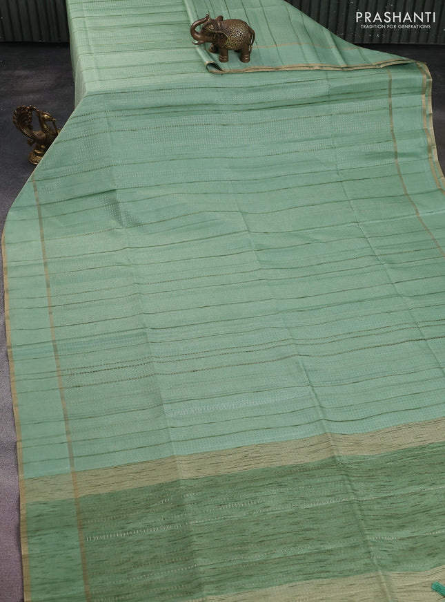 Semi matka saree pastel green with allover zari weaves and rettapet zari woven border