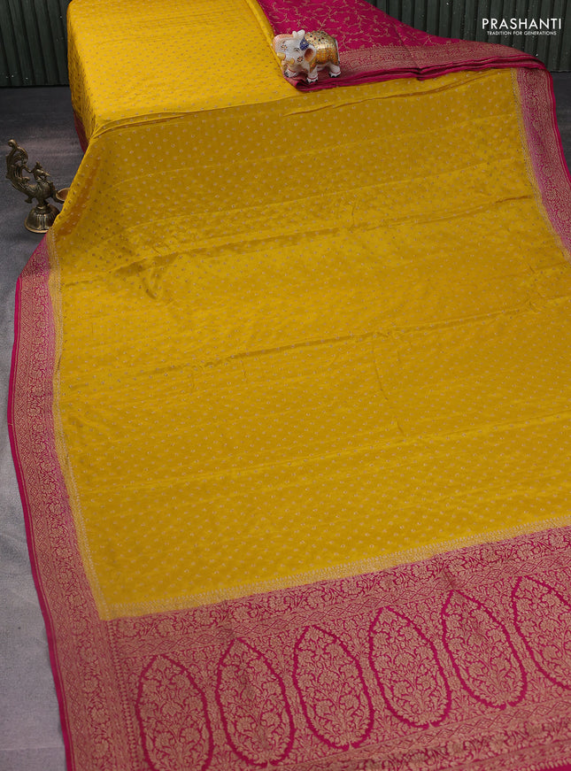 Banarasi crepe partly saree mustard yellow and pink with woven buttas and woven border