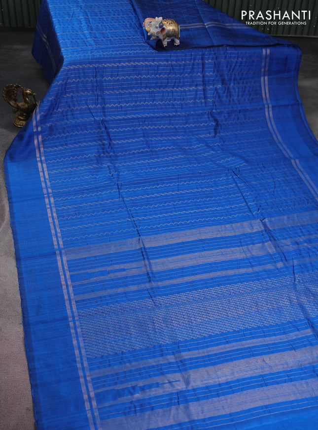 Pure dupion silk saree cs blue with allover zari weaves and zari woven simple border
