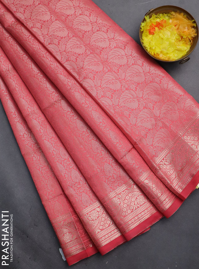 Semi soft silk saree peach shade with allover zari woven brocade weaves -Without blouse