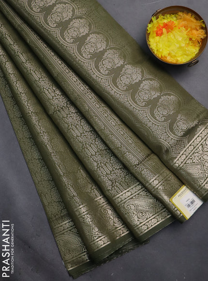 Semi soft silk saree sap green with allover zari woven brocade weaves -Without blouse