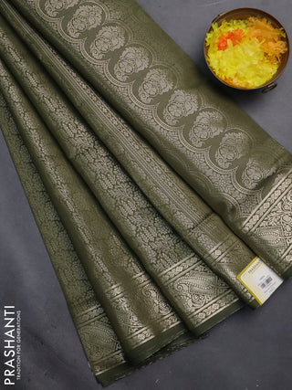 Semi soft silk saree sap green with allover zari woven brocade weaves -Without blouse
