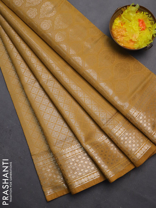Semi soft silk saree mustard yellow with allover zari woven brocade weaves -Without blouse