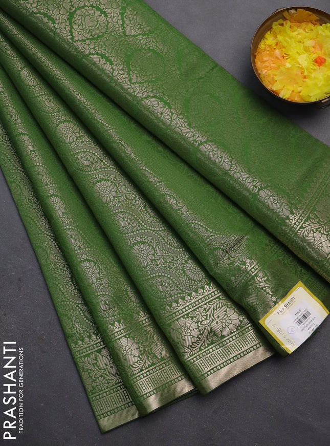 Semi soft silk saree green with allover zari woven brocade weaves -Without blouse