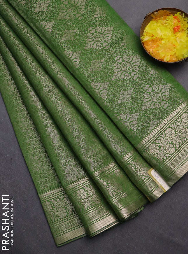 Semi soft silk saree green with allover zari woven brocade weaves -Without blouse