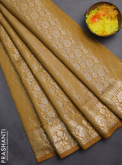 Semi soft silk saree mustrad yellow with allover zari woven brocade weaves -Without blouse