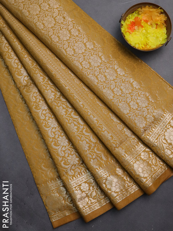 Semi soft silk saree mustrad yellow with allover zari woven brocade weaves -Without blouse
