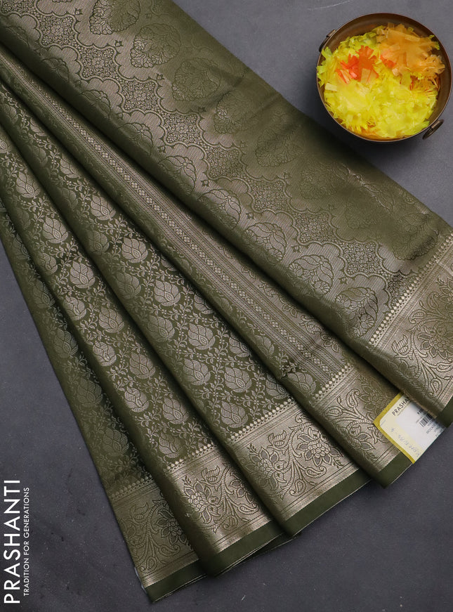 Semi soft silk saree sap green with allover zari woven brocade weaves -Without blouse