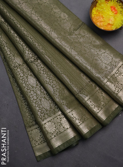 Semi soft silk saree sap green with allover zari woven brocade weaves -Without blouse