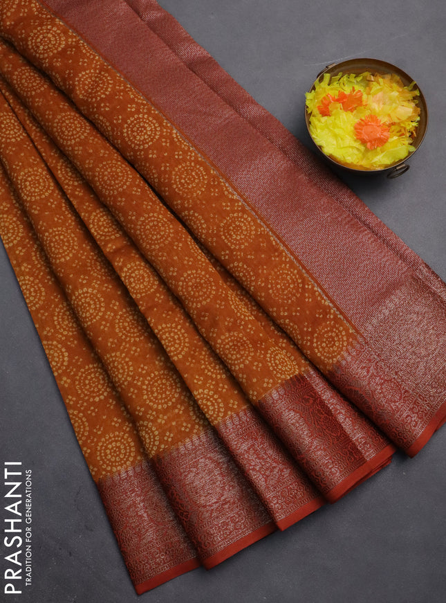 Chanderi silk cotton saree dark mustard and rust shade with allover prints and banarasi style border