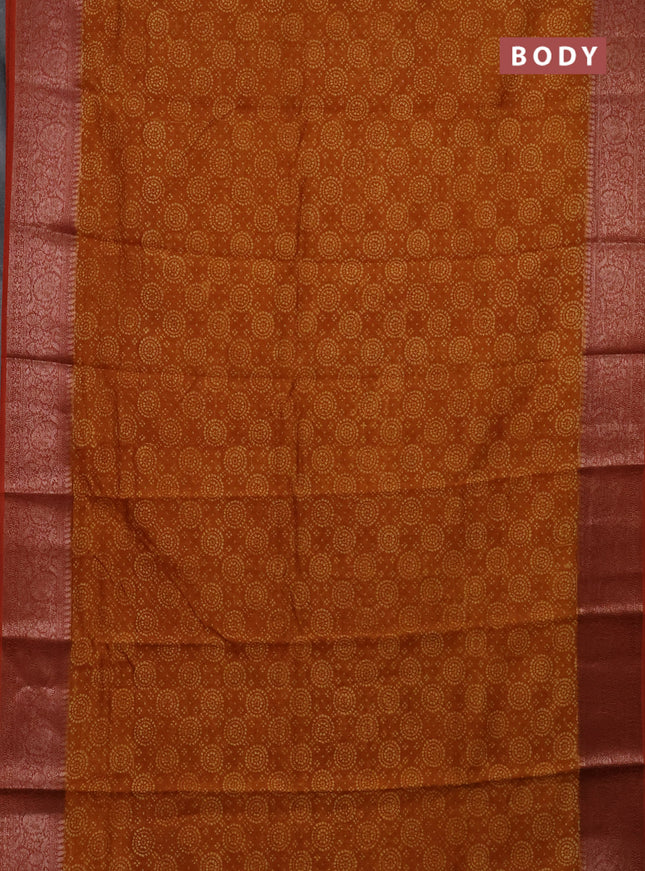 Chanderi silk cotton saree dark mustard and rust shade with allover prints and banarasi style border